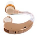 Close up view of AXON F-138 hearing aid transparent sound tube and battery compartment