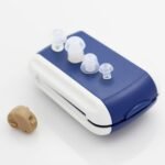 Complete AXON K-80 hearing aid set with blue case and transparent earplugs on white background