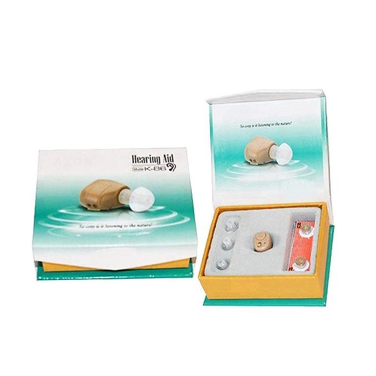 AXON K-86 hearing aid retail packaging box closed and open, displaying the amplifier device, ear tips, and accessories.