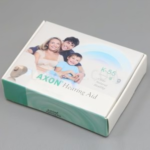 Axon K55 hearing aid box packaging showing family image and best price in Pakistan.
