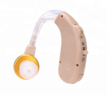 Beige BTE AXON hearing aid with clear tube and golden front detail for discreet wearing in Karachi.