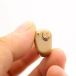 Handheld compact Axon hearing aid design showing small size for customers in Karachi.