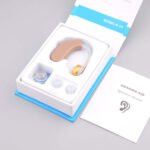 Model B-13 hearing aid package contents open box displaying the device and manual.
