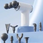 White handheld massager with multiple spherical parts and various attachment accessories on a light blue background.