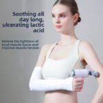 Woman using a handheld massager on her arm with a white support strap for muscle recovery.