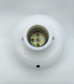 Detailed view of white bulb holder metal structure and lens mechanism