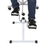 Person using pedal exerciser under desk on office chair under desk bike Pakistan
